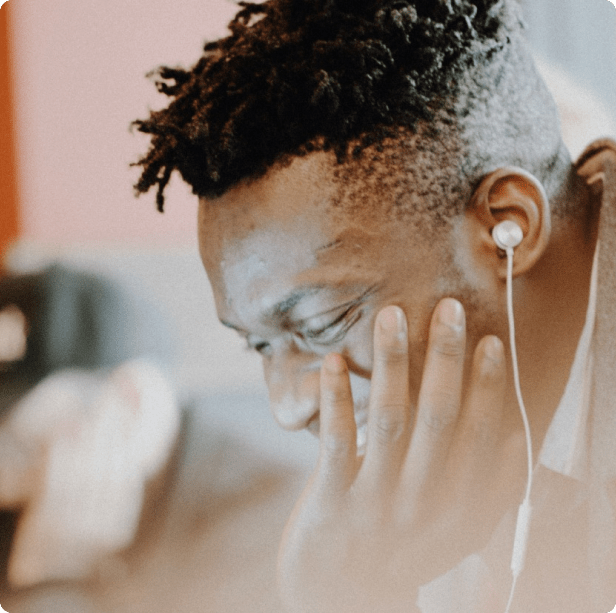 remote developer smiling and working with headphones in